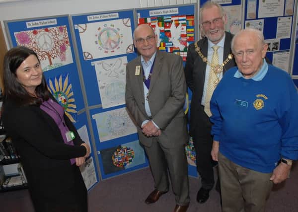 NADV 1511035AM H'gate Lion's School Arts Project. Team leader at Harrogate Library Sam Findley with Eric Wright (Harrogate Lions president) The Mayor of Harrogate Coun. Nigel Simms and Harrogate Lions member Bob Norris.  (1511035AM)