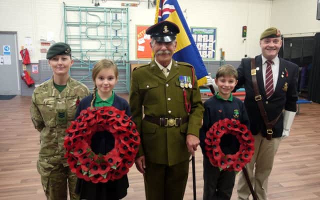 Children from Bradshaw Primary School mark Remembrance Day