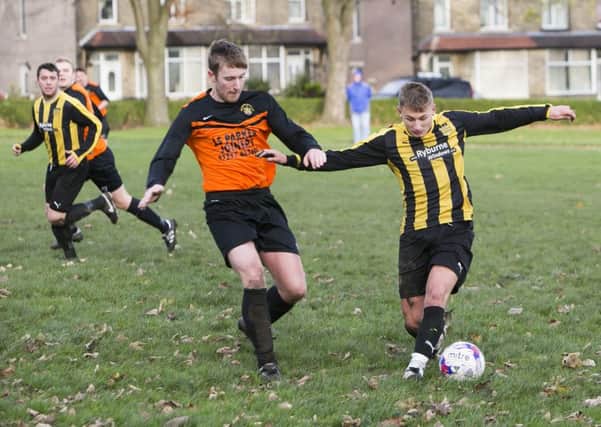 Football - Brighouse Sports v Midgley United. James Speak for Brighouse and Toby Standering for Midgley.