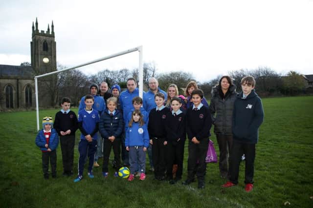 Brighouse Juniors FC on their playing field which is plauged with dog fouling.