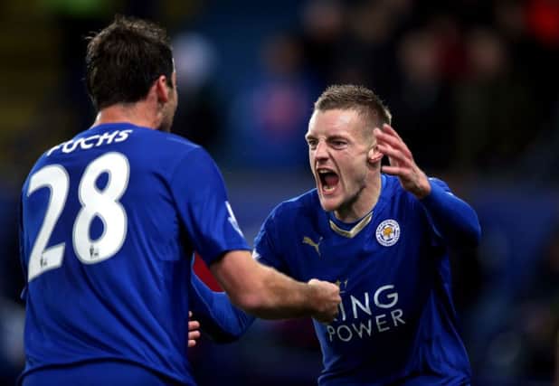 Leicester City's Jamie Vardy celebrates scoring his side's first goal of the game with Christian Fuchs during the Barclays Premier League match at the King Power Stadium, Leicester. PRESS ASSOCIATION Photo. Picture date: Saturday November 28, 2015. See PA story SOCCER Leicester. Photo credit should read: Mike Egerton/PA Wire. RESTRICTIONS:  EDITORIAL USE ONLY No use with unauthorised audio, video, data, fixture lists, club/league logos or "live" services. Online in-match use limited to 75 images, no video emulation. No use in betting, games or single club/league/player publications.