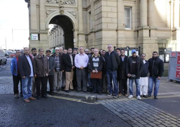 Calderdale taxi drivers protest outside HalifaxTown Hall.