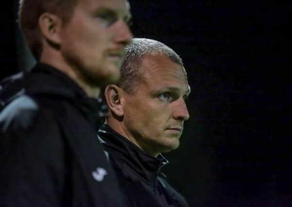 Harrogate Railway boss Lee Ashforth, centre, was unhappy with the bust-up during Saturday's abandoned clash against Ossett Town