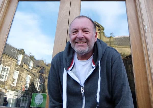 Dale Hibbert, whose life story, including a role in the early months of rock band The Smiths, has been published. Dale is pictured outside his cafe, Kava, in Todmorden