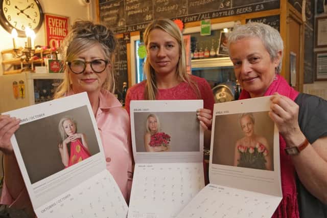 Charity event, at Calan's, Hebden Bridge, to raise money for the Pink Train Charity, helping Latvian women diagnosed with breast cancer. Calendar girls Jennifer Fairclough, Gita Gintere and Zinta Uskale