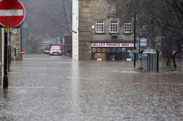 Boxing day flood in Hebden Bridge. New Road under water on a day when floods caused chaos across the north of the country.
