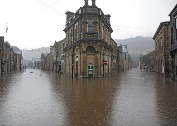 Boxing day flood in Hebden Bridge. Lloyds Bank an island in Albert Street.