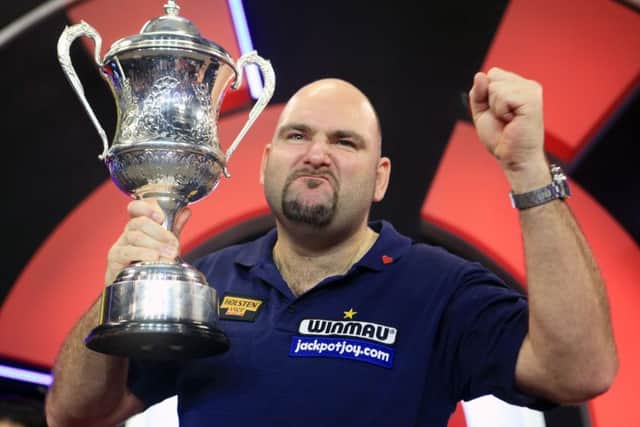 Scott Waites celebrates with the trophy during the BDO World Championship Final at the Lakeside Complex.