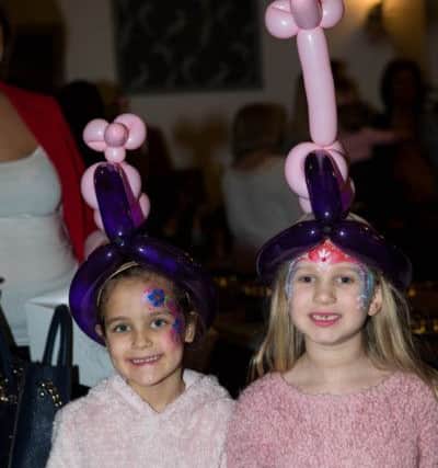 Grace Cawley and Millie Duncan at the Sowerby Bridge flood relief fundraiser, Bolton Brow WMC.