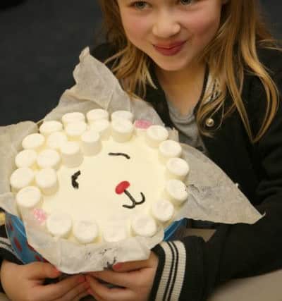 Calderdale school fund raise for the flood victims. Matilda Tindal, aged seven, at St John's Academy, Clifton.