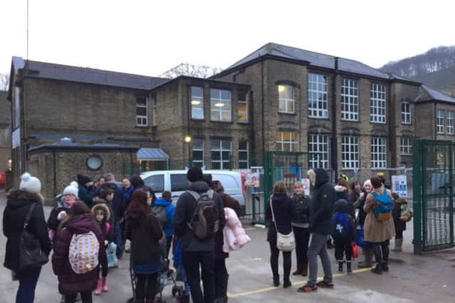 Riverside School, Hebden Bridge. Parents drop off children.
