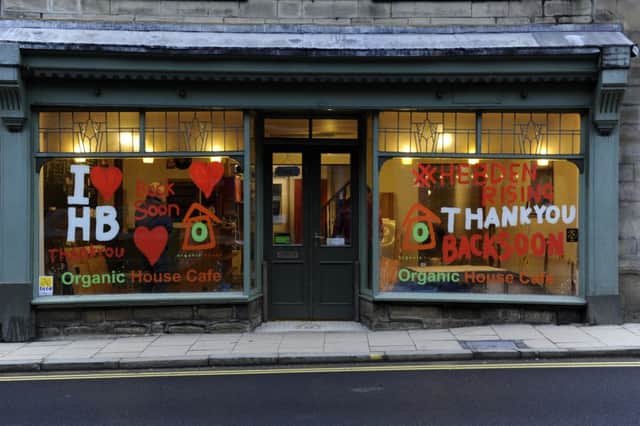 Organic House Cafe window.
Hebden Bridge on the first day back at work following the Boxing Day floods.  4 January 2016.  Picture Bruce Rollinson