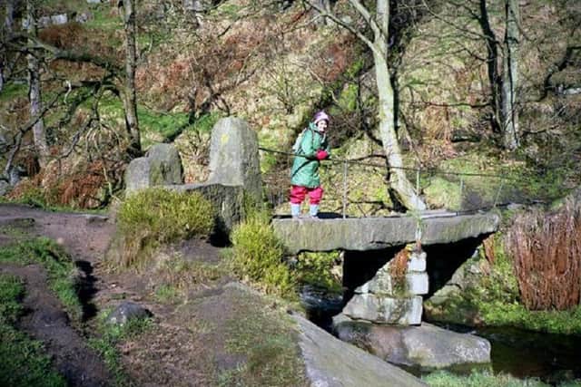 Both the Pennine Way and the Calderdale Way paths cross Colden Water by this primitive stoneslab bridge. Photo: Stuart Leah