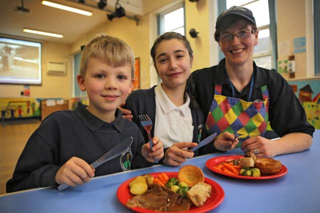 Bolton Brow Primary Schoo winners of Food For Life's Sunday Roast Day. Cook Ravhel Fleming with Freddie Lowcock aged eight and Mollie Hall aged ten.
