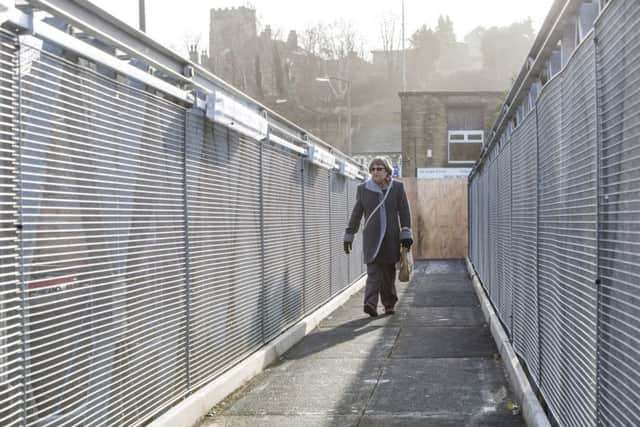 Sandra Beal walks across the newly opened pedestrian Bridge, Elland.