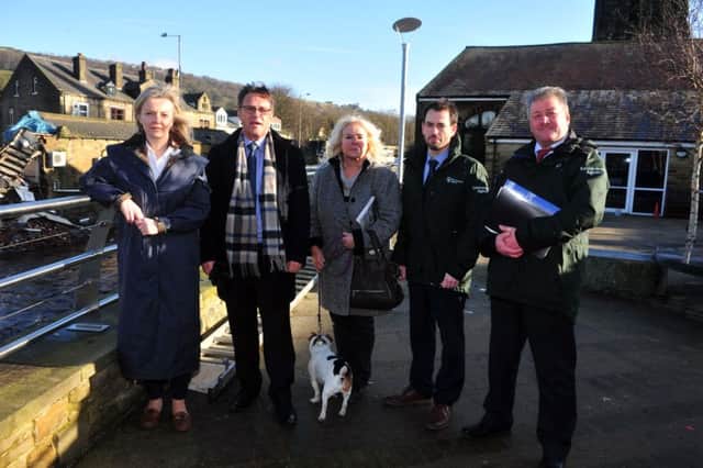 28 January 2016.......      Elizabeth Truss MP, Secretary of State for Environment, Food and Rural Affairs with Craig Whitaker MP, Cllr Jill Smith-Moorhouse and Adrian Gill with Mark Scott from the Enviroment Agency  during a quick visit to see Mytholmroyd following the floods over Christmas. Picture Tony Johnson