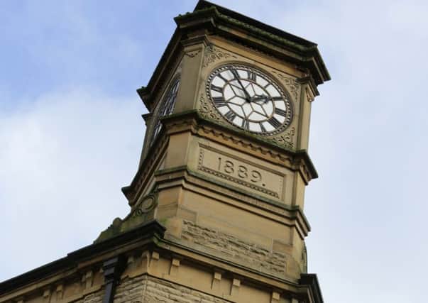 Restored clock on Carlton Buildings, Hebden Bridge.