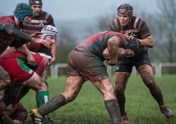 Luke Illingworth makes a tackle for Old Rishworthians at Kerighley