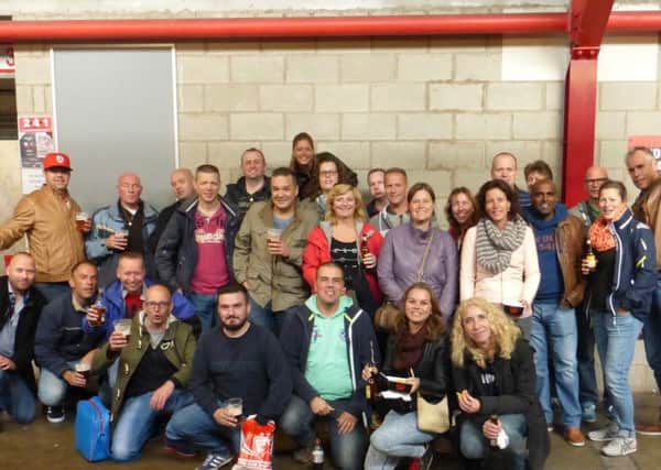 A group of football fans from Holland who will be attending FC Halifax Town's game with Forest Green Rovers. Here they are pictured at Oakwell in Barnsley last October