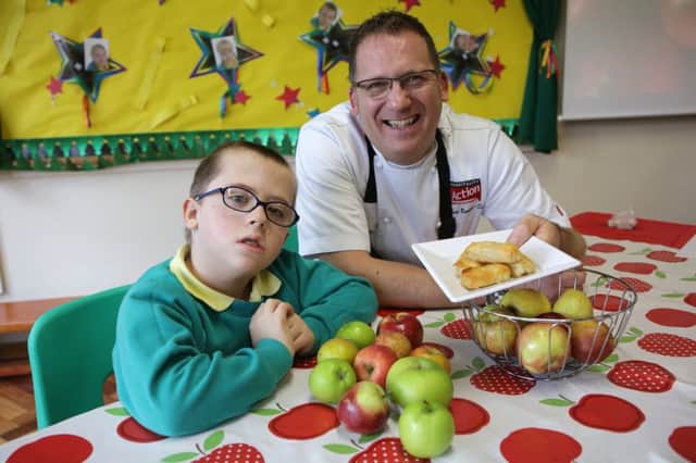 Chef Matthew Benson Smith with nine-year-old Owen Blakey at Highbury School, Rastrick.