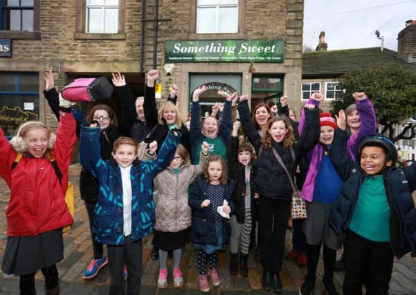 Something Sweet Owner Gemma Leedham celebrating the donation with Judith from McCarthy and Stone, Sarah Smith and school children from Hebden Bridge.



credit:  leeboswellphotography.com