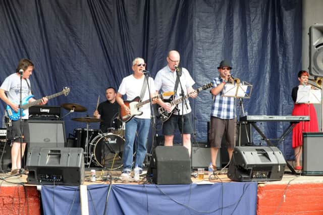 27 july 2013.
Farmfest 2013 was held at Grange Farm, Halifax, on Saturday.
The Surge on stage.