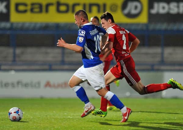 Waide Fairhurst, then of Macclesfield, holds off FC Halifax Town's James Bolton during a game at Moss Rose. Picture: Mike Glendenning
