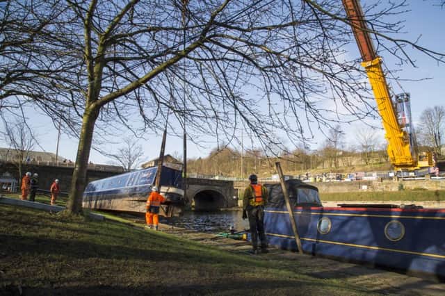 Barge being lifted back on to the canal by Elland Bridge.