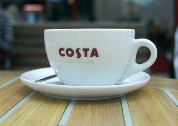 File photo dated 21/07/11 of a cup from a Costa Coffee shop as Whitbread who owns the coffee chain has warned it will have to hike prices as it faces a "substantial" hit from plans for a new national living wage. PRESS ASSOCIATION Photo. Issue date: Tuesday September 8, 2015. Whitbread, which is one of the UK's biggest employers with more than 45,000 staff, said it was working on plans to offset the cost of next year's introduction of a Â£7.20 an hour national living wage. See PA story CITY Whitbread. Photo credit should read: Lewis Whyld/PA Wire