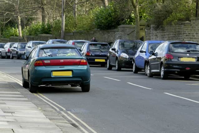 Picture taken of illegally parked cars outside Lee Mount school on Wednesday.  The car on the left is on double yellow lines, the one on the right is on yellow zig zag lines and the rest are legally parked.