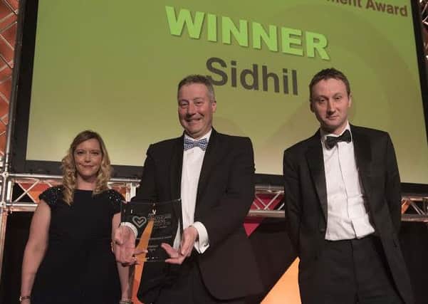 Sidhil receiving the Outstanding Achievement Award at the Medilink Yorkshire and Humber Healthcare Business Awards.