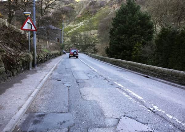 A potholed stretch of Burnley Road close to Knotts Bend, between Lydgate and Cornholme