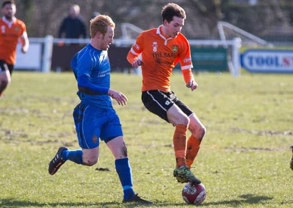 Tom Haigh in action for Brighouse Town v Clitheroe