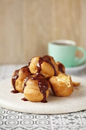 ASK Italian has worked with food psychologist Dr Christy Fergusson to identify the science behind temptation and precisely what makes certain foods impossible to resist. Pictured are ASK Italian profiteroles. See Ross Parry copy RPYPUD : The science behind food temptation has been revealed by boffins who used a temptation ratio to create Britain's most tempting DESSERT.   The Chocolate Lava Mountain provides an irresistible temptation combination and has been unveiled just in time for National Dessert Day tomorrow (Wed). Diners are invited to pour molten toffee onto a chocolate cup, causing it to melt and reveal cool vanilla gelato sitting on rich chocolate fondant. The smells of warm chocolate and toffee, the sight of the chocolate cup softening and the temperature and texture contrast with the cool creamy ice cream all add to the tempting pud. ASK Italian has worked with food psychologist Dr Christy Fergusson to identify the science behind temptation and precisely what makes certain foods impossible to resi