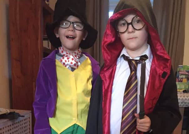 Ewan Kettlewell as harry Potter and Freddie Kettlewell as Willy Wonka.