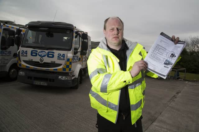Owner of 606 Recovery Jason Bowerbank with the parking fine letter and the recovery vehicle.