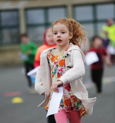 Children at Withinfields School, Southowram doing a Race for Life. Millie Ellerby aged six.