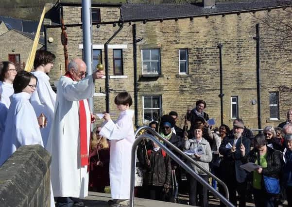 Parishioners and friends of the church met on the bridge in Mytholmroyd and, re-enacting the triumphant entry of Jesus into Jerusalem, they walked to the church to celebrate Mass for the first time since it was devastated by flooding earlier this year.