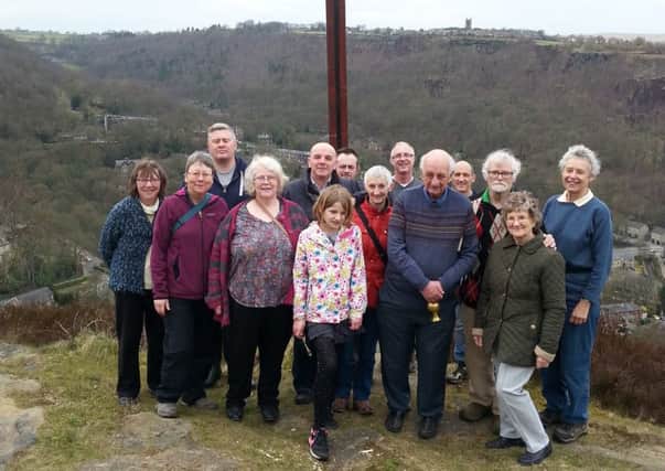 The new cross in place at Horsehold, Hebden Bridge, with members of Chuirches Together in Hebden Royd