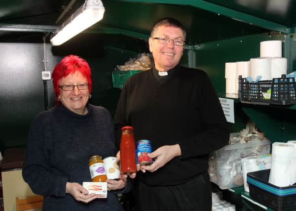 Janet Garner and canon Owen Page in he food store, Todmorden Food Drop In, St Mary's church, Todmorden