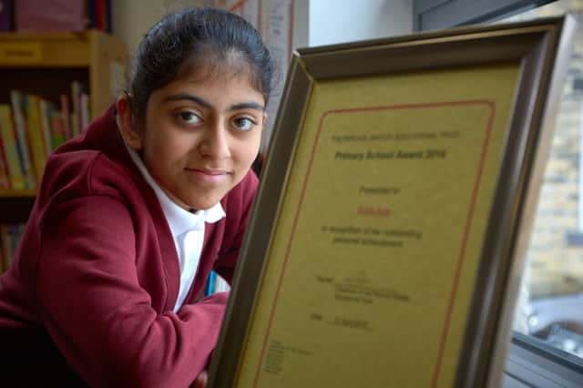 Percival Whitley Educational Trust winner Sidra Ilyas, aged eleven, at Savile Park Primary School, Halifax.