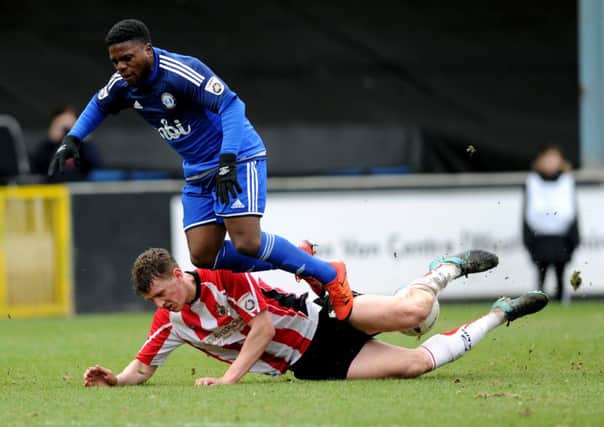 Vanarama National League.
FC Halifax v Altrincham.
Halifax's Shaquille MacDonald is brought down by Altrincham's Scott Leather.
26th March 2016.
Picture : Jonathan Gawthorpe