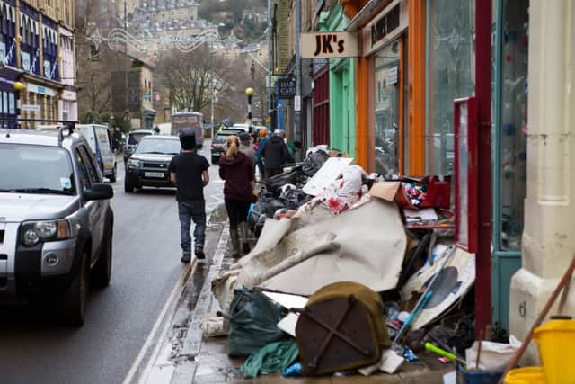 The big clean-up continues on Market Street, Hebden Bridge, after the Boxing Day floods, 2015