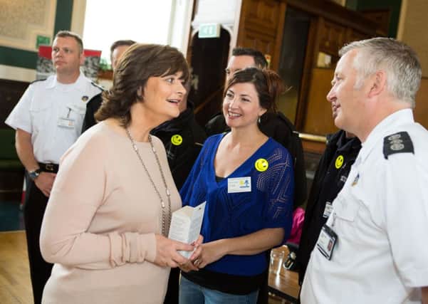 Official launch of Dementia Friendly Todmorden, Todmorden Town Hall in 2015. Pictured is Cherie Blair, Lisa Candlin and Sgt Dominic Furby from the Fire Service