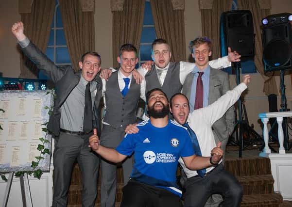 Adopted Halifax Town fan Jared Gray wearing his shirt at the wedding reception of his friend Nick McQueen in Rishworth