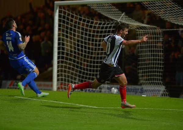Grimsby's Padraig Amond celebrates after scoring one of his team's seven goals against Town in October.