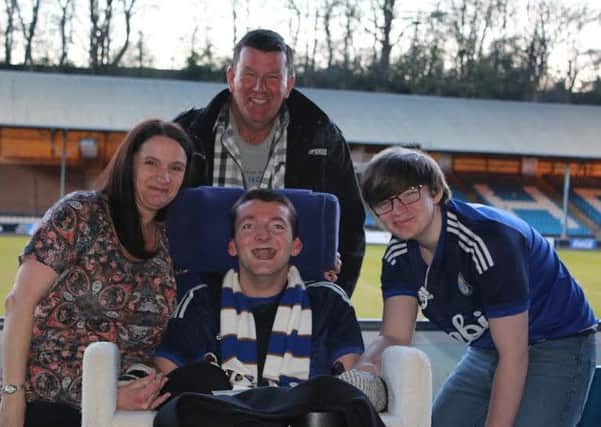 Adam Heslop with his mum Samantha, dad Steve and brother Josh. Picture by Darren Murphy