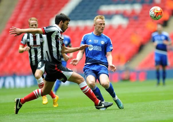 The FA Trophy Final.
FC Halifax v Grimsby Town.
Halifax's Jordan Burrow takes on Grimsby's Shaun Pearson.
22nd May 2016.
Picture : Jonathan Gawthorpe