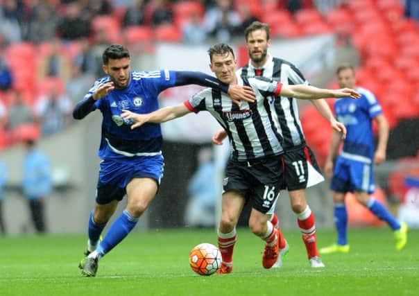 The FA Trophy Final.
FC Halifax v Grimsby Town.
Halifax's Hamza Bencherif battles with Grimsby's Craig Clay.
22nd May 2016.
Picture : Jonathan Gawthorpe