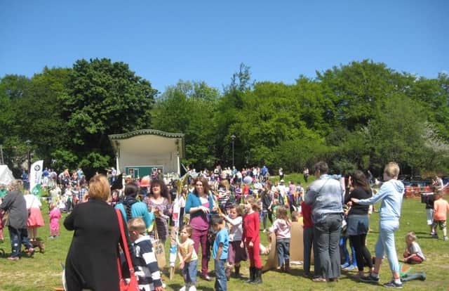 Crowds gather in the sun at Centre Vale Park for Todmorden Charity Carnival 2013